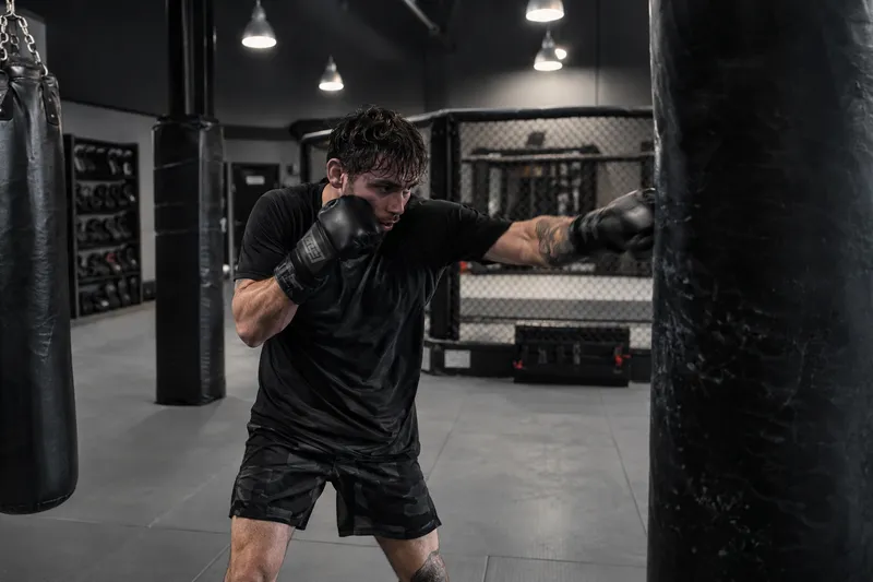 Adult practicing punches on a heavy bag