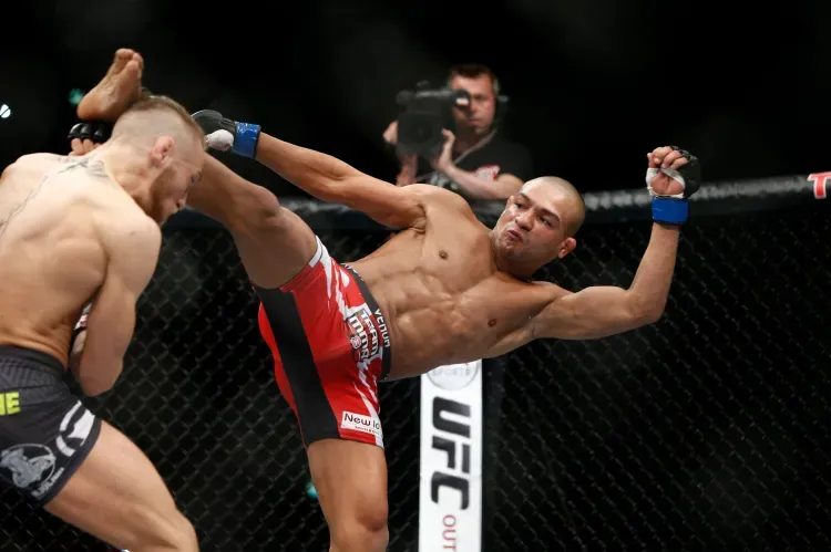 Diego Brandão throwing a kick during an MMA bout